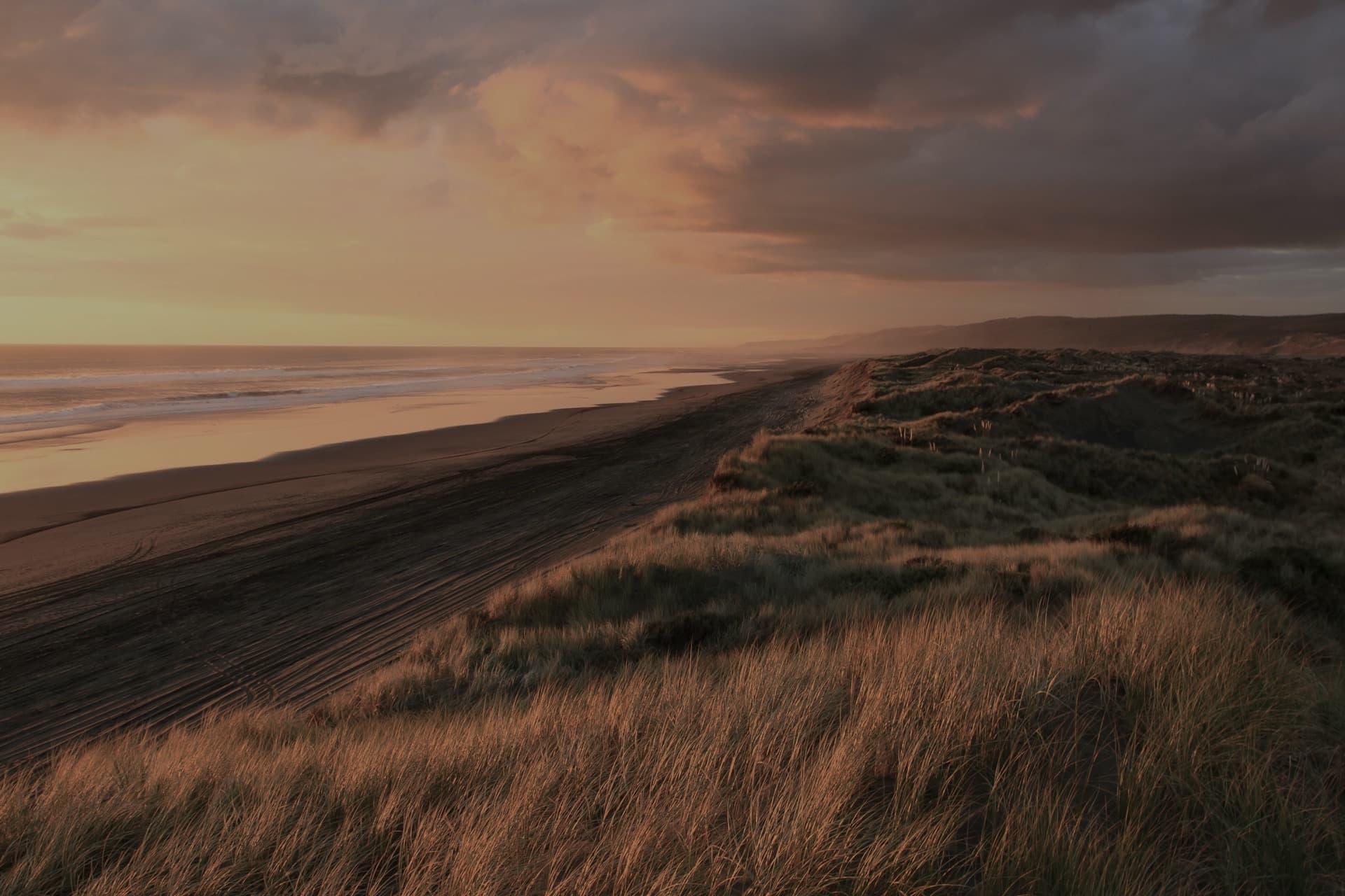 The same coastal sunset before the edit
